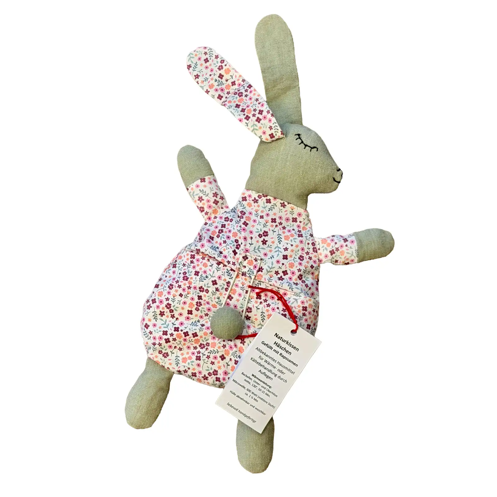 Handgefertigtes Naturkissen «Häschen» mit Rapssamenfüllung und gemusterter Stoffhülle, freigestellt vor weissem Hintergrund. Stiftung 50 Plus.